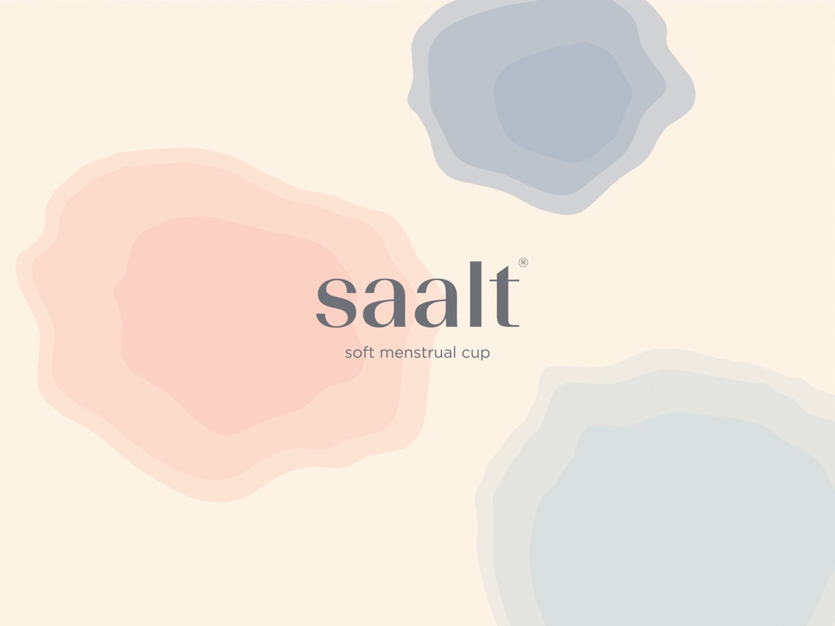 Saalt logo on a background of swirling pink and blue shapes. There is text below that reads "Soft menstrual cup"