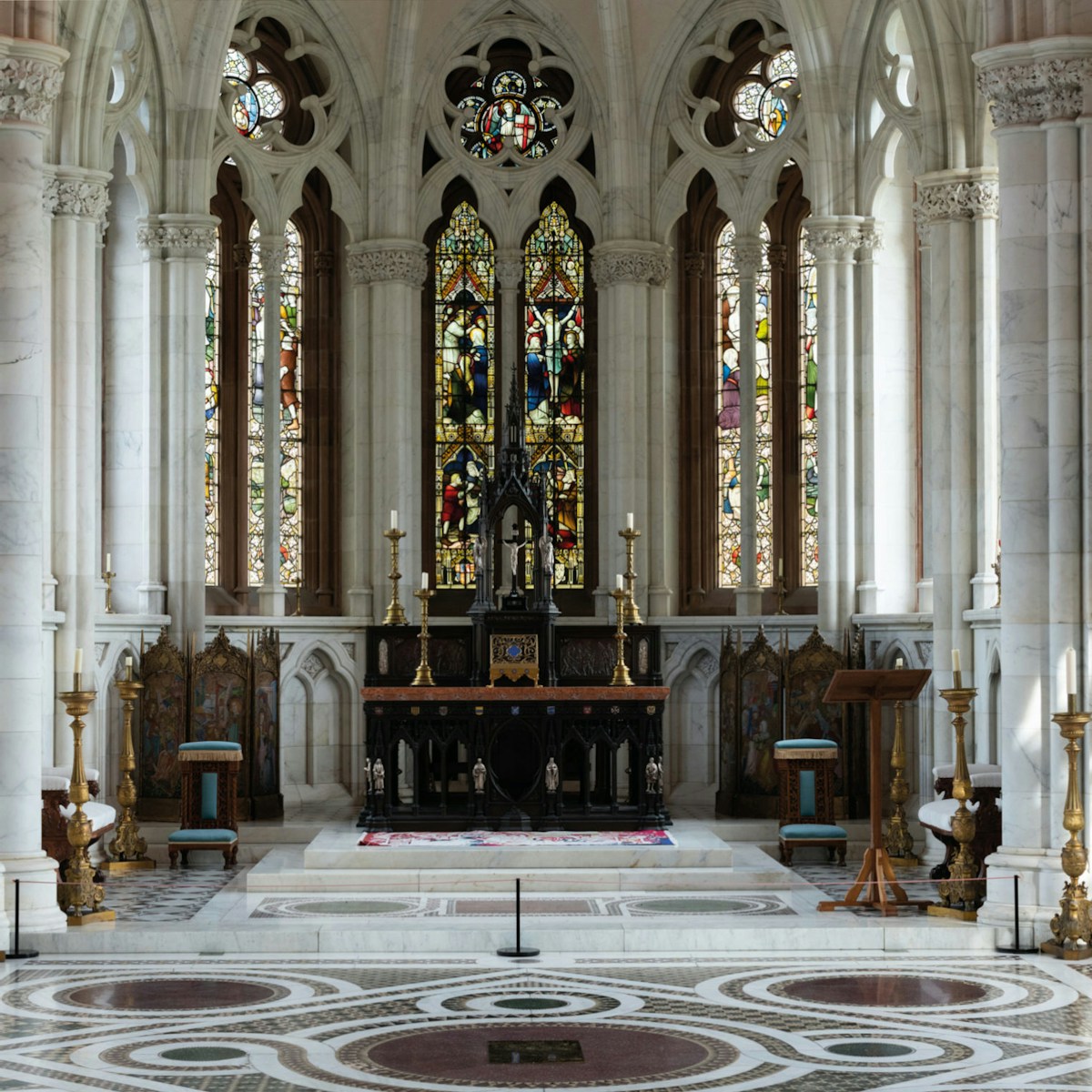 Interior shot of church with stained glass windows.