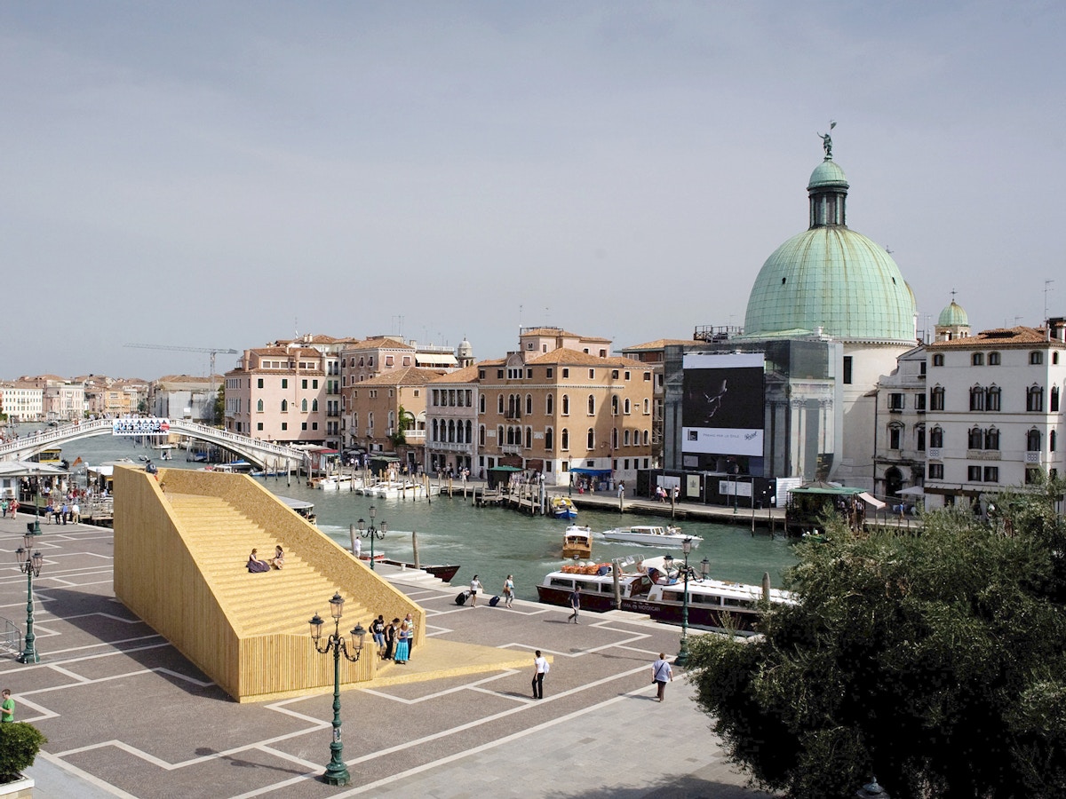 Skyline of Venice. In the foreground there is a wooden structure.
