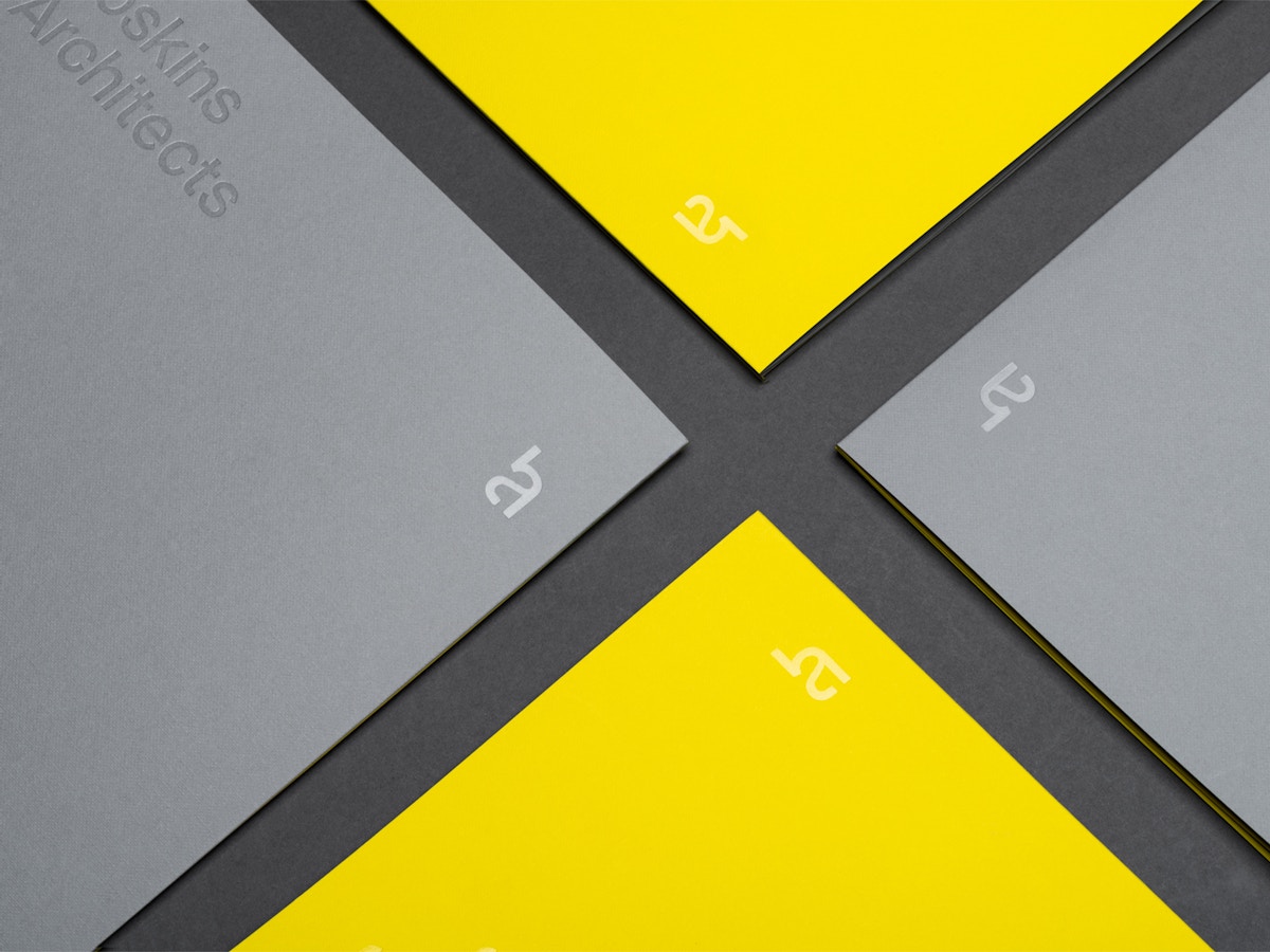 Yellow and grey brochure covers.